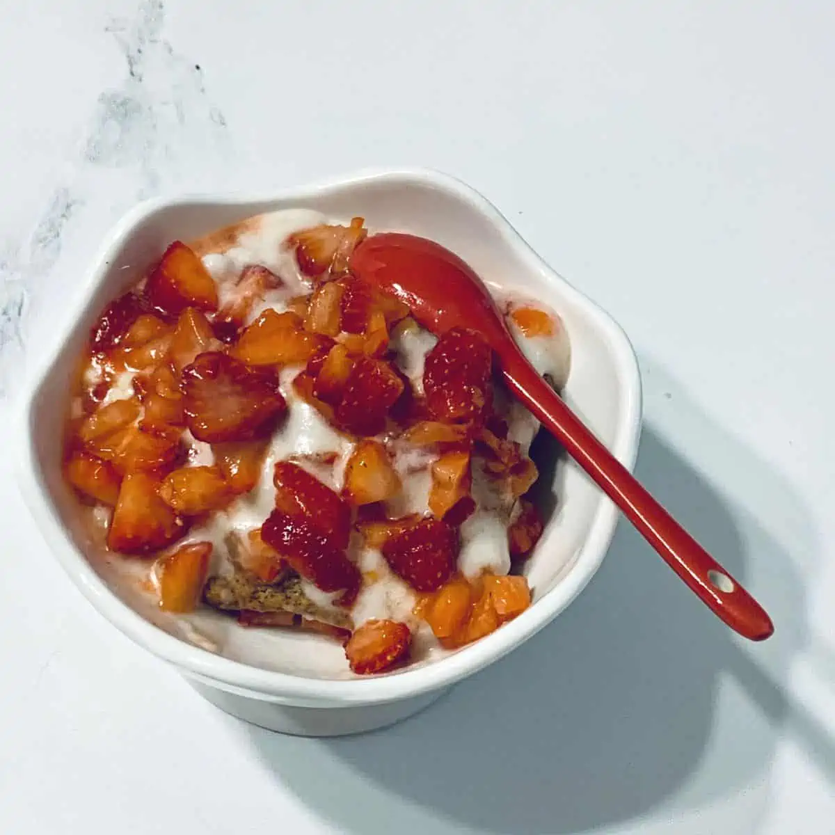 Homemade strawberry shortcake made with gluten free ingredients in a white dish.