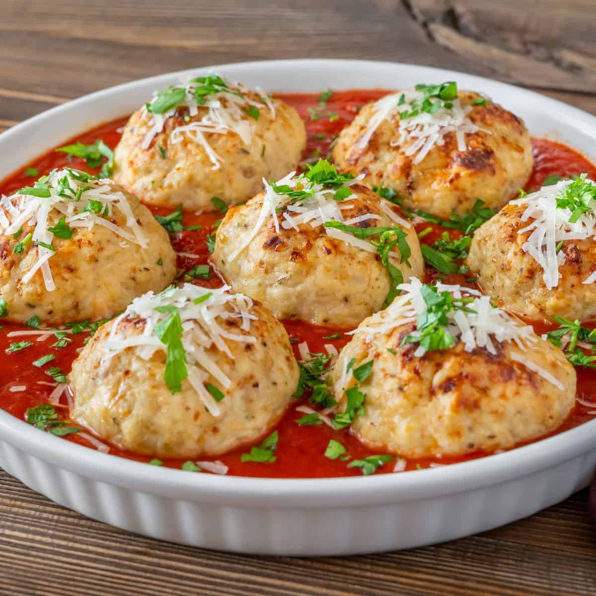 Paleo turkey zucchini meatballs in a white dish.