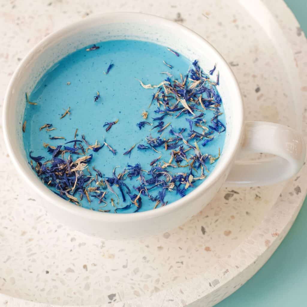 Relaxing Moon Milk in a ceramic mug with dried lavender.