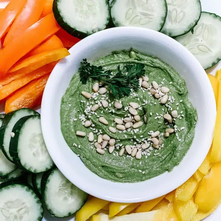 Simple and good green goddess hummus recipe served with fresh vegetables.