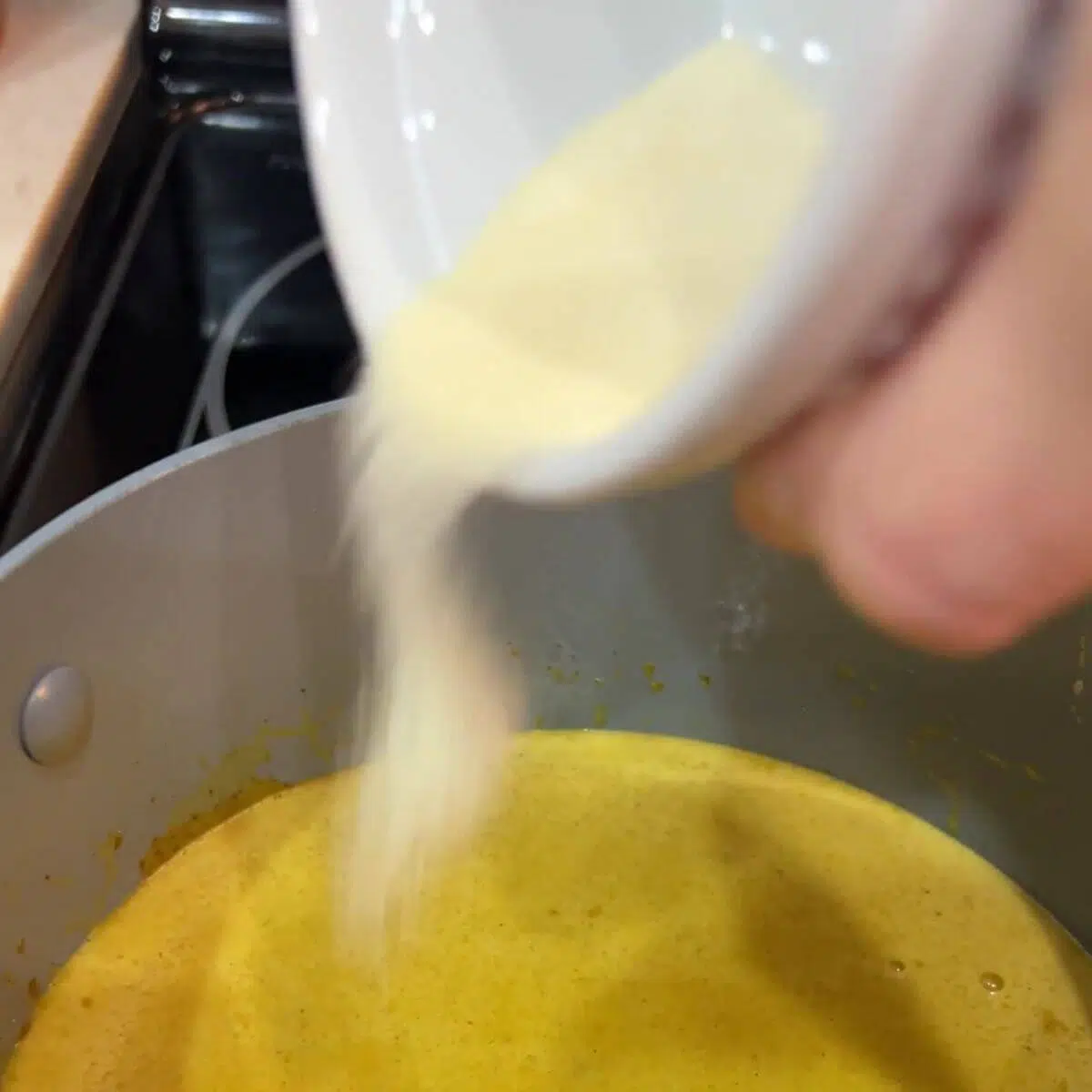 Remove from heat and sprinkle gelatin powder over the mixture.