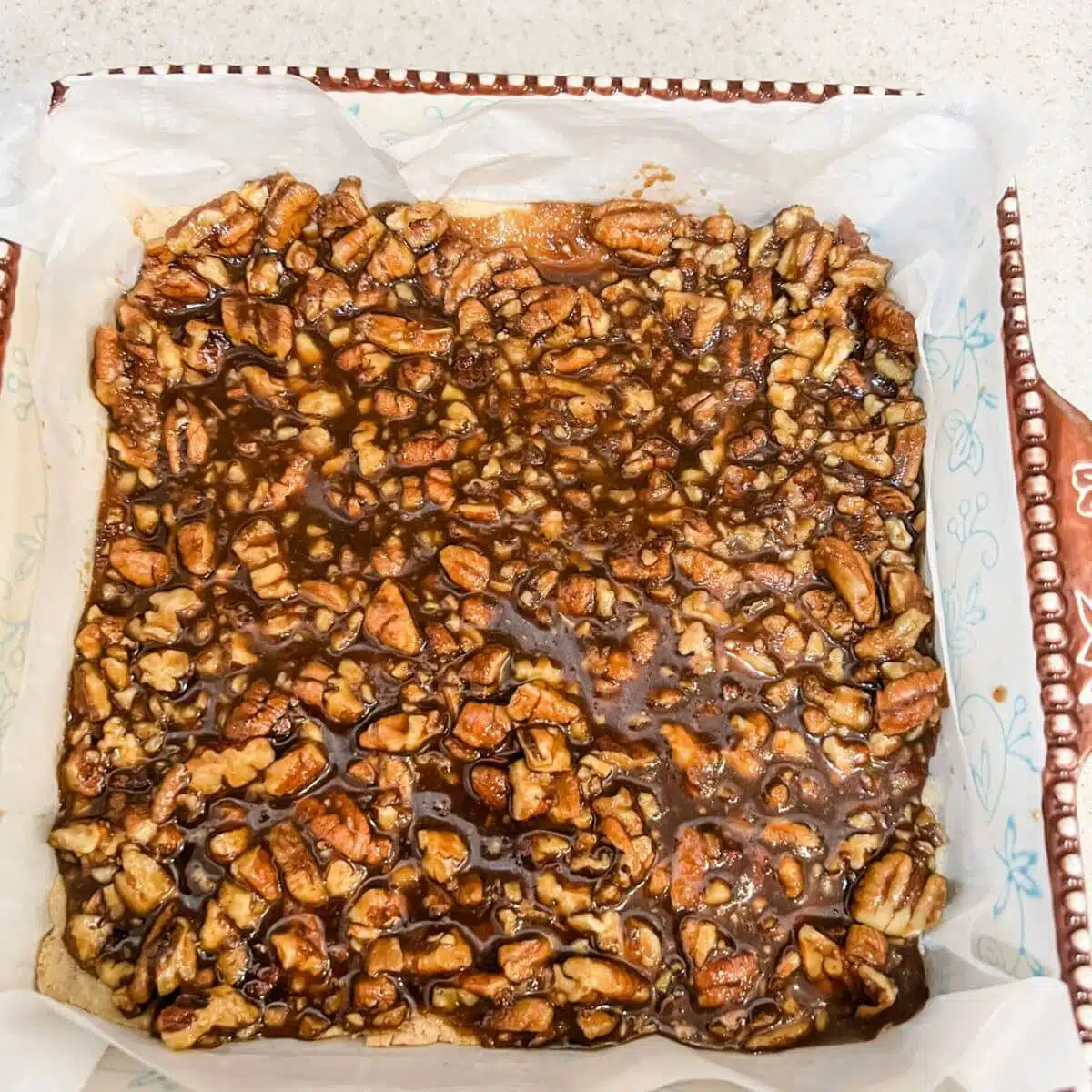 Pour the filling mixture over the top of the cooled shortbread pie crust.