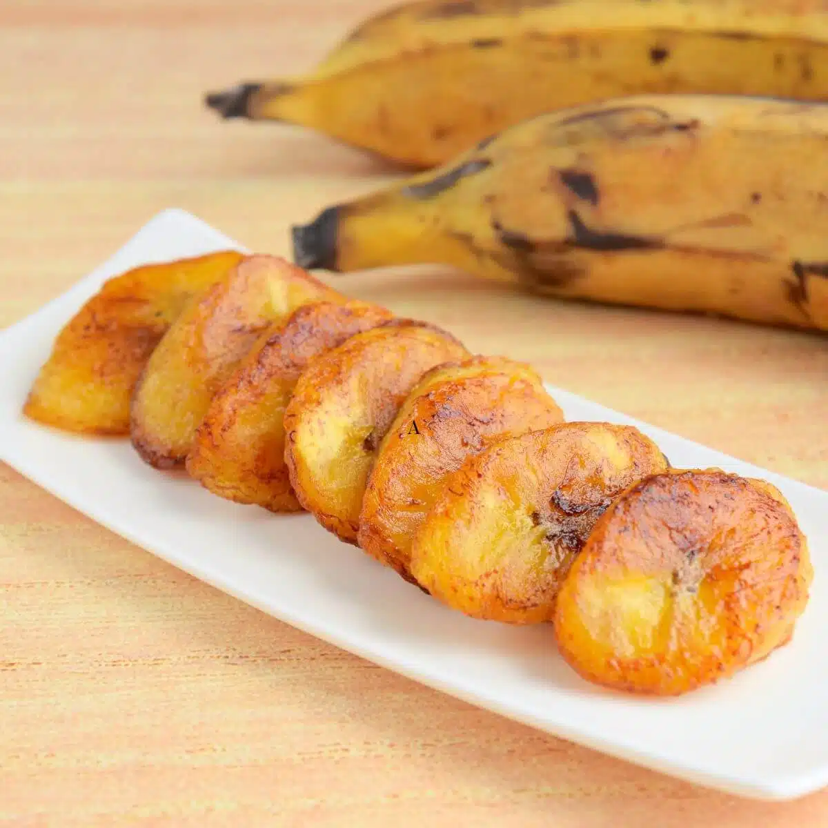 baked plantains on white plate